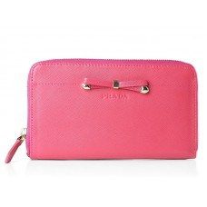 Cartera Prada Saffiano con cremallera y detalle de lazo en rosa intenso