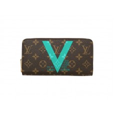 Cartera con cremallera y monograma de Louis Vuitton en turquesa